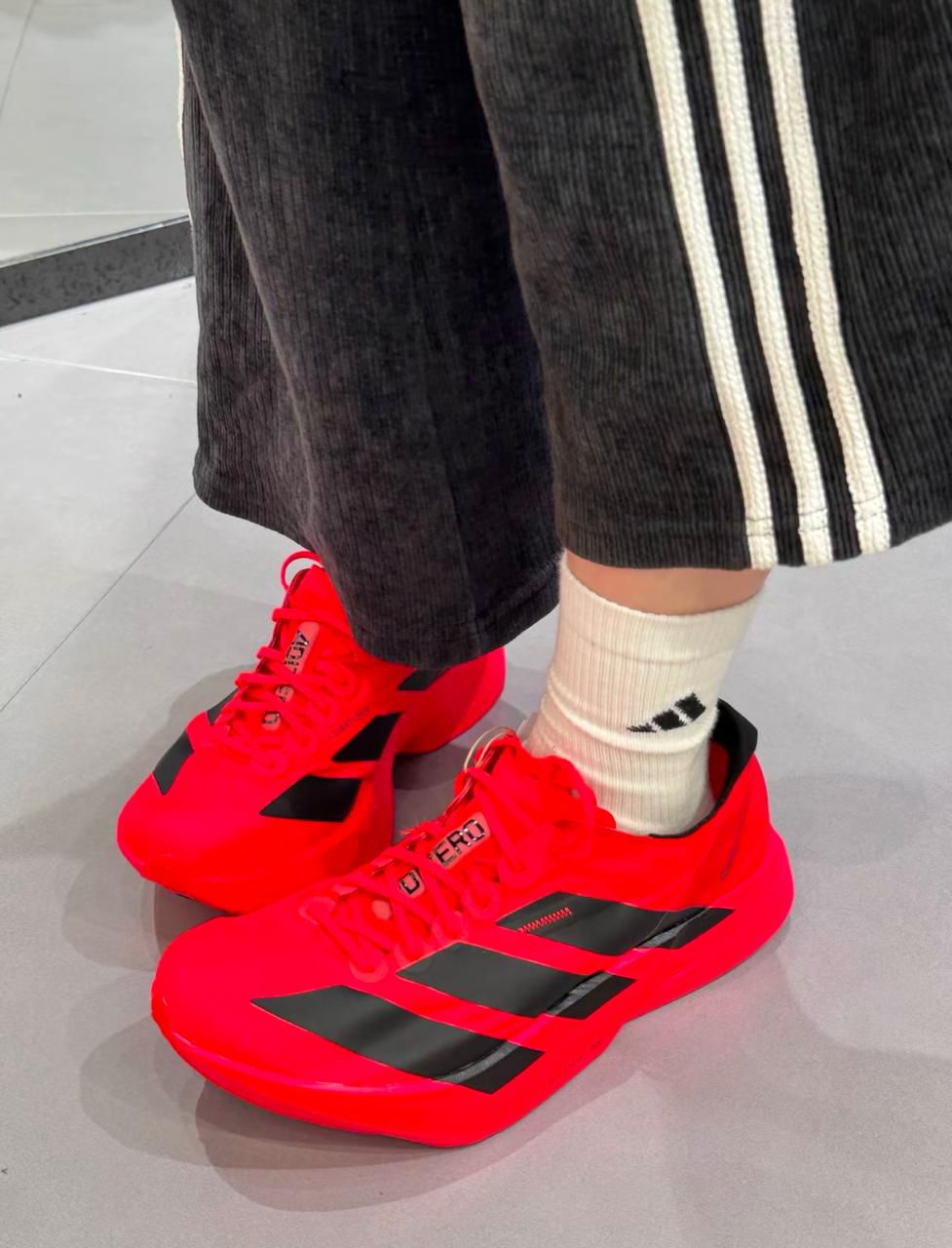 Adidas Adizero Adios Pro 4 shoes in Lucid Red and Black
Adidas Adizero Adios Pro 4 running shoes