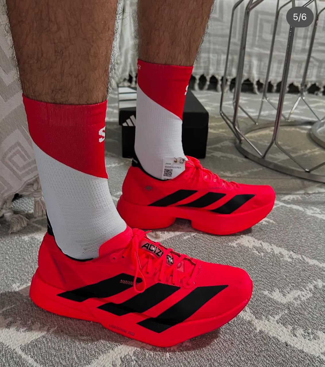 Adidas Adizero Adios Pro 4 shoes in Lucid Red and Black
Adidas Adizero Adios Pro 4 running shoes