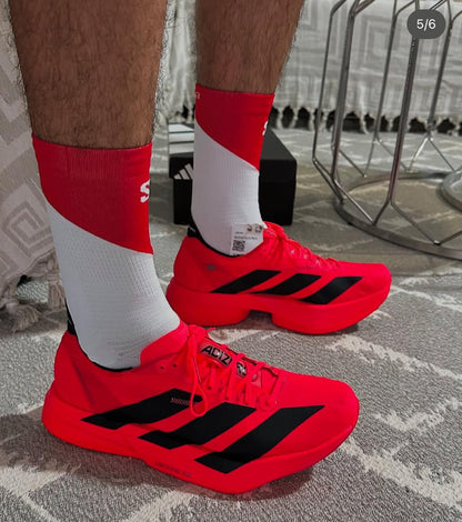 Adidas Adizero Adios Pro 4 shoes in Lucid Red and Black  
Adidas Adizero Adios Pro 4 running shoes
